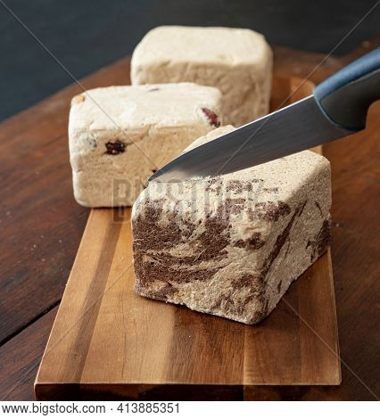 Halva Almond Nuts And Cocoa Pieces On Wooden Table Background