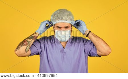Beginning Of Virus Outbreak. Man Doctor Uniform Yellow Background. Type Of Virus. Coronavirus Concep