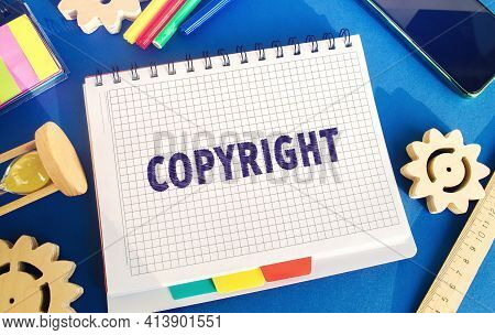 Notebook With The Word Copyright. Patenting. Copyright Protection. Brand And Patent. The Fight Again