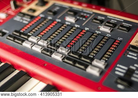 Close-up Of The Hammond Section Of A Professional Red Classic Stage And Live Concert Keyboard, With 