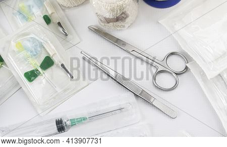 Basic Medical Kit For Rapid Health Care In Nursing Due To An Emergency Or Emergency With Scissors, S