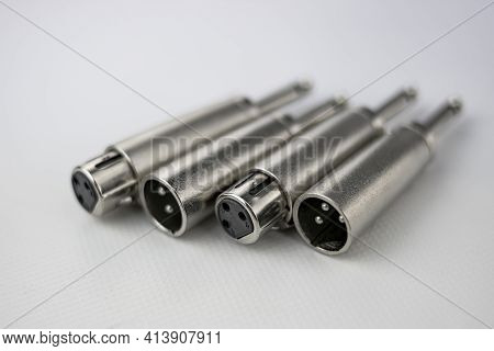 Close-up Of Male And Female Xlr Inputs In Audio Signal Converter To Mono Jack Type On White Backgrou