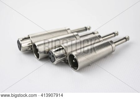 Audio Signal Converters From Male And Female Xlr To Mono Jack Type, In The Foreground And On White B