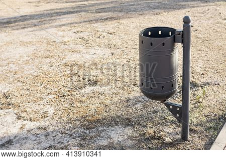 Anti-vandalism Metal Bin Installed In The Center Of A European City Without Waste Or Garbage Collect