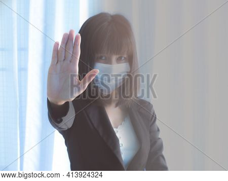 Corona Covic-19 With Blur Image Of Asia Woman With Black Shirt Wearing The Respiratory Protection Ma