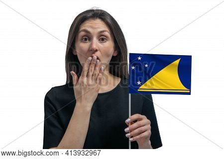 Happy Young White Woman Holding Flag Of Tokelau And Covers Her Mouth With Her Hand Isolated On A Whi