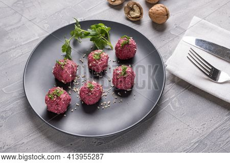 Georgian Beetroot Phali Or Pkhali With Walnuts, Garlic And On Black Plate