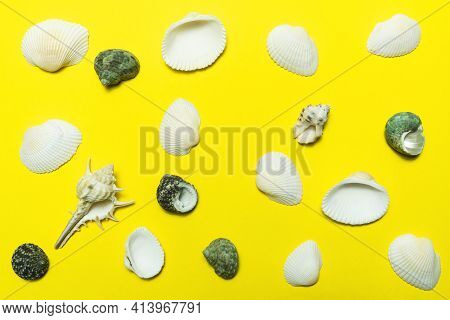 Pattern Of Seashells On A Bright Yellow Background.