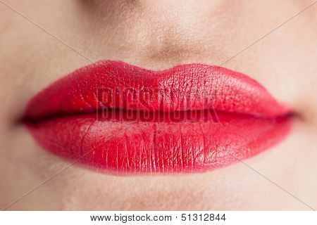 Extreme close up on sensual voluminous red lips