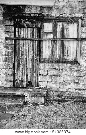 old dilapidated, a boarded up the house