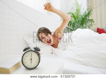 Angry Young Woman Wants To Break Awakened Her Alarm Clock