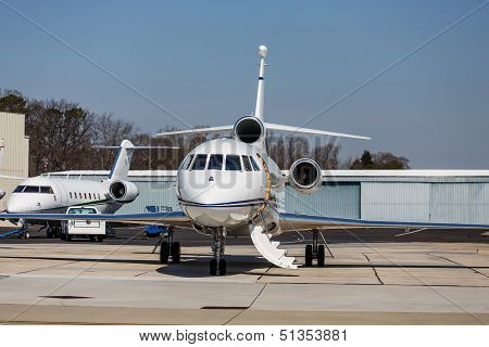 Two Private Jets By Hangers