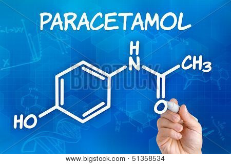 Hand with pen drawing the chemical formula of paracetamol