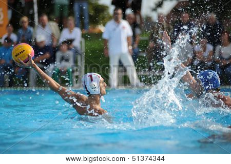 KAPOSVAR, HUNGARY - SEPTEMBER 15: Farkas Dory (7) in action at a Hungarian championship water-polo game between Kaposvar (white) and Honved (blue) on September 15, 2013 in Kaposvar, Hungary