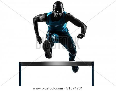 one african man hurdler running  in silhouette studio isolated on white background