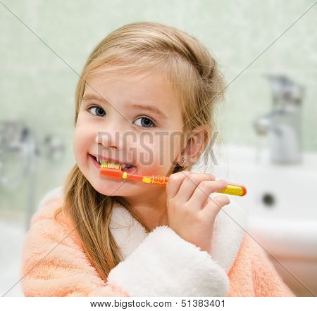Smiling Little Girl Brushing Teeth