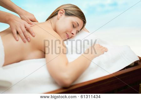Relaxed woman receiving a massage
