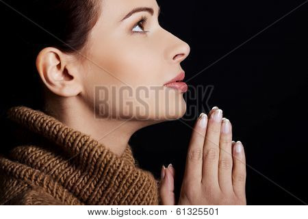 Believing woman praying to God