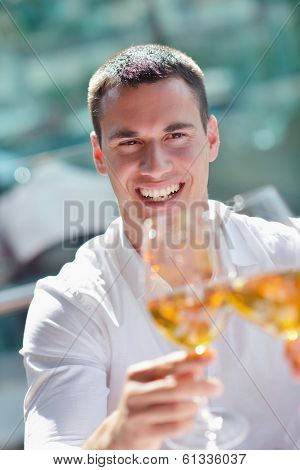 happy young couple having lanch at beautiful restaurant on the beach