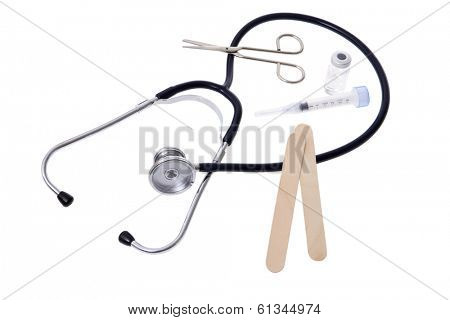 medical still life with stethoscope, scissors, needle, and tongue depressor
