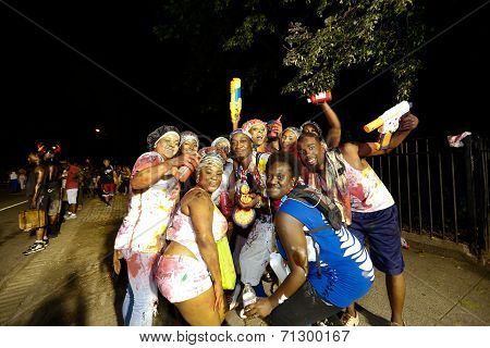 Happy group posing in NYPD light