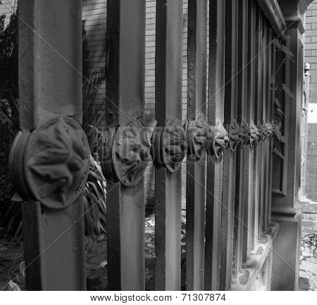 Property fence with decorative medallion