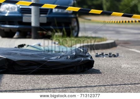 Corpse In Plastic Bag After Car Accident