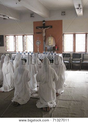 KOLKATA, INDIA - JANUARY 27: Sisters of Mother Teresa's Missionaries of Charity in prayer in the chapel of the Mother House, Kolkata, India at January 27, 2009
