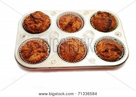 Homemade Banana Muffins Cooling In A Baking Tin