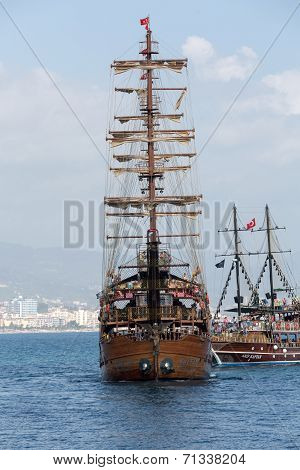 Tourists enjoying sea journey on vintage sailships in Alanya Turkey.