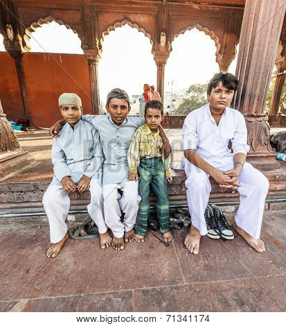 Group Of Worshipers Rest On Courtyard Of Jama Masjid Mosque In Delhi