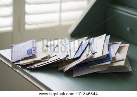 Closeup of letters on writing desk at home