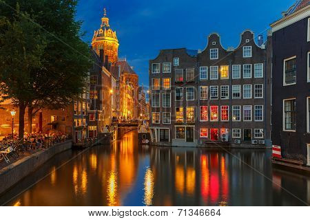 Night City View Of Amsterdam Canal, Church And Bridge