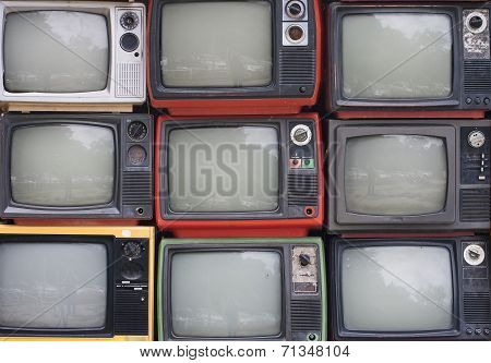 A wall of old televisions