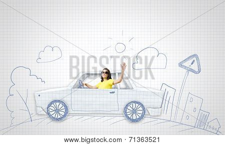 Young woman riding car made of list of paper