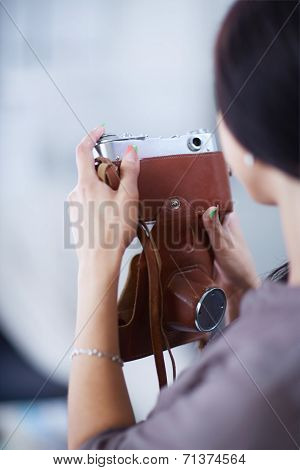 Woman is a proffessional photographer with camera