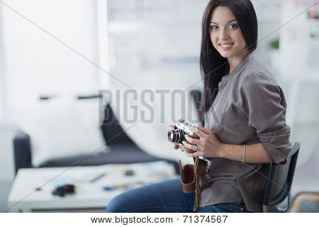 Woman is a proffessional photographer with camera