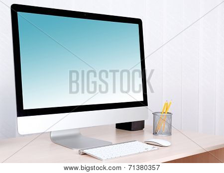 Computer with screensaver on table