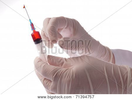 Hand With Syringe Isolated On White