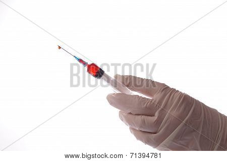 Hand With Syringe Isolated On White