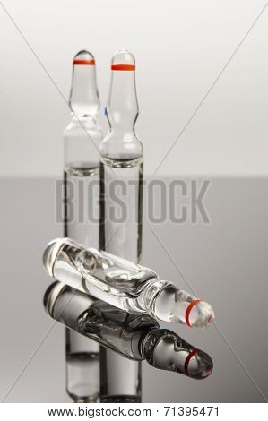 Clear Medical Ampules Isolated On Black Background