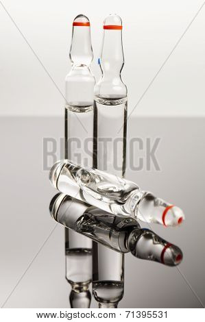 Clear Medical Ampules Isolated On Black Background