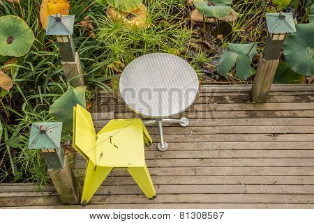 Single chair and table on deck