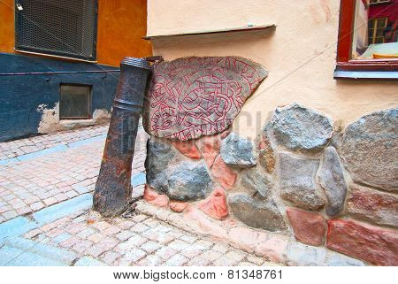 Sweden. Stockholm. Ancient runestone built into a wall in Gamla Stan (Old Town)