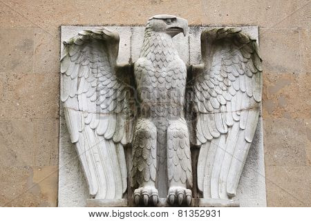 BERLIN, GERMANY - JANUARY 6, 2015: German Eagle from the 1930s on the main building of the Tempelhof Airport in Berlin, Germany. 