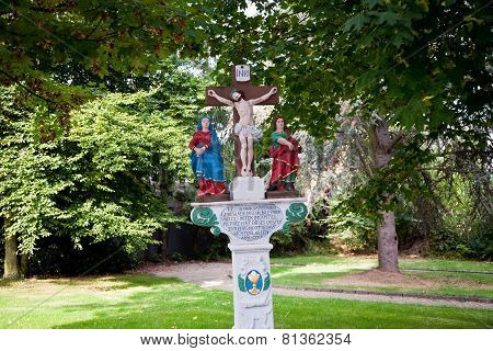 LEIWEN, GERMANY - OCT 4, 2010: old painted crucifix to remember a dead priest near Trittenheim Moselle Germany