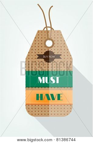 One brown, hanging sticker with pattern and text Must Have, Buy Now