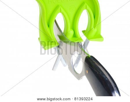 closeup of knife and sharpener/honer/polisher being used in the polishing position