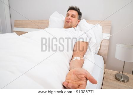Patient Resting On Bed With Iv Drip