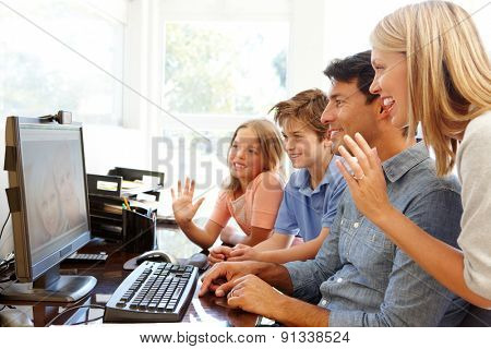 Family using skype in home office